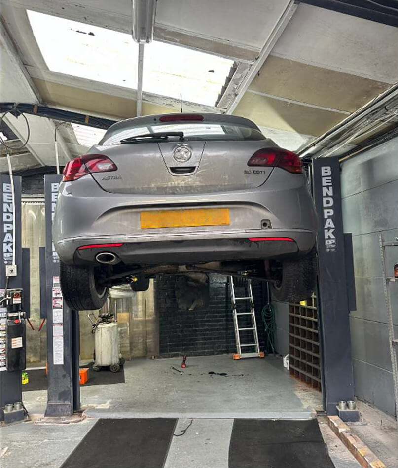 Car on a ramp raised in the air